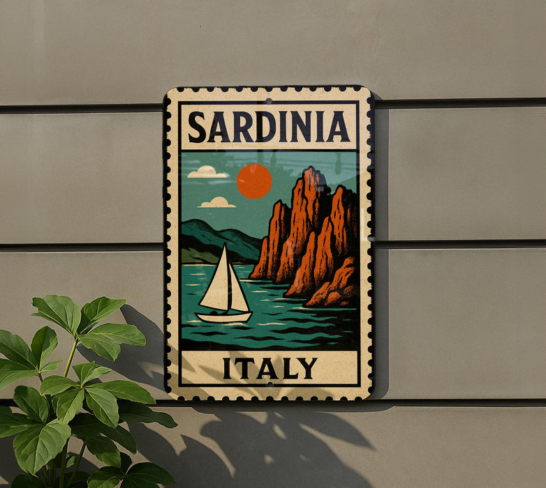 A vintage-style metal sign with a sailboat and mountains in the background, mounted on a wall.