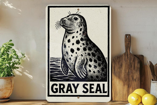A sign featuring a black and white illustration of a gray seal, with the text "GRY SEAL" below it.