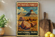 A framed vintage-style stamp depicting a scenic landscape with a mountain, pine trees, and large tree trunks, with the text "PETRIFIED FOREST NATIONAL PARK USA" on it.