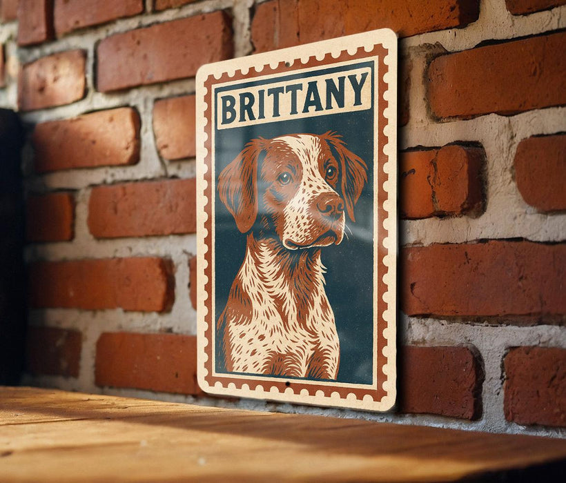 A metal sign featuring a portrait of a dog with the name "BRITTANY" on it, mounted on a brick wall.