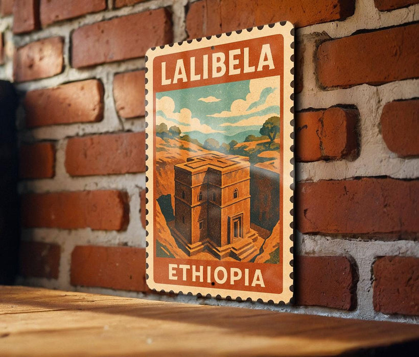 A vintage-style poster of Lalibela, Ethiopia, featuring a brick wall and a building illustration, is displayed on a wooden surface.