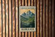 A Carpathian Mountains postage stamp is displayed on a wooden wall.