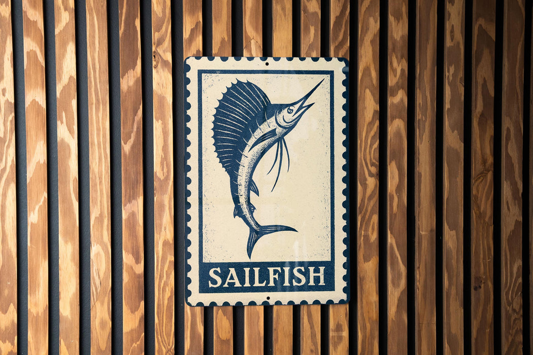 A metal sign with a blue and white design featuring a sailfish is mounted on a wooden wall.
