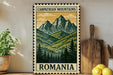 a vintage-style metal sign with a mountain landscape and pine trees, placed on a wooden surface next to a wooden cutting board and a potted plant.