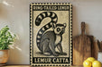 A framed illustration of a lemur, a type of primate, is displayed on a wall next to a wooden cutting board and some lemons.