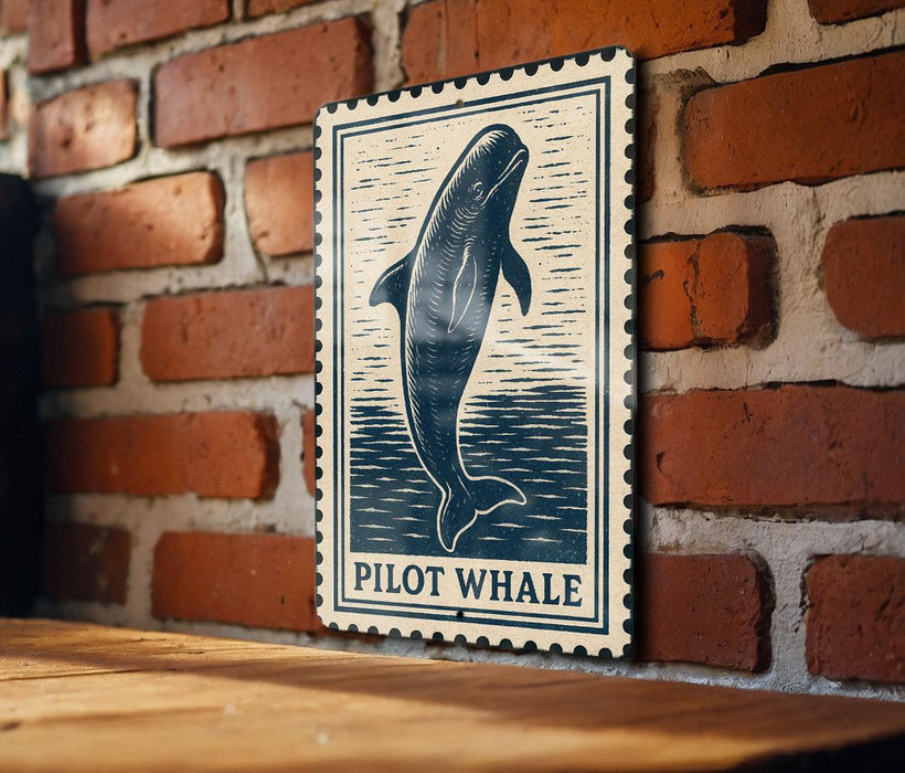A sign featuring a pilot whale is mounted on a brick wall.
