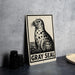 A metal sign featuring a black and white illustration of a seal, with the text "GRAY SEAL" below it.