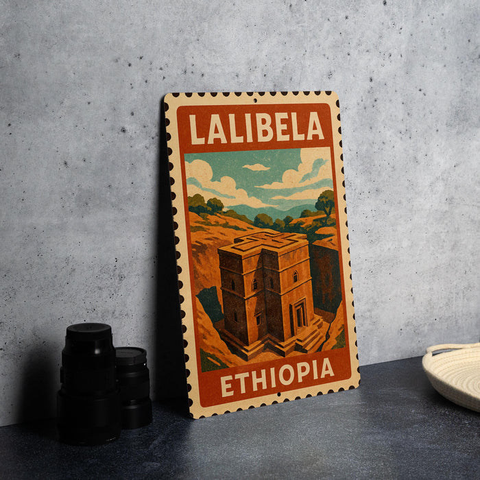 A vintage-style stamp depicting the Lalibela, a famous landmark in Ethiopia, is displayed on a table.