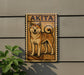 a wooden sign with a picture of a dog, specifically an Akita breed, mounted on a wall.