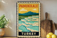 A vintage-style poster of Pamukkale, a famous geyser in Turkey, displayed on a wall next to a wooden cutting board and some potted plants.