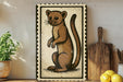 a wooden cutting board, a potted plant, and a framed illustration of a brown cat.