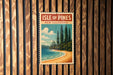 A vintage-style poster of the Isle of Pines in New Caledonia is displayed on a wooden wall.