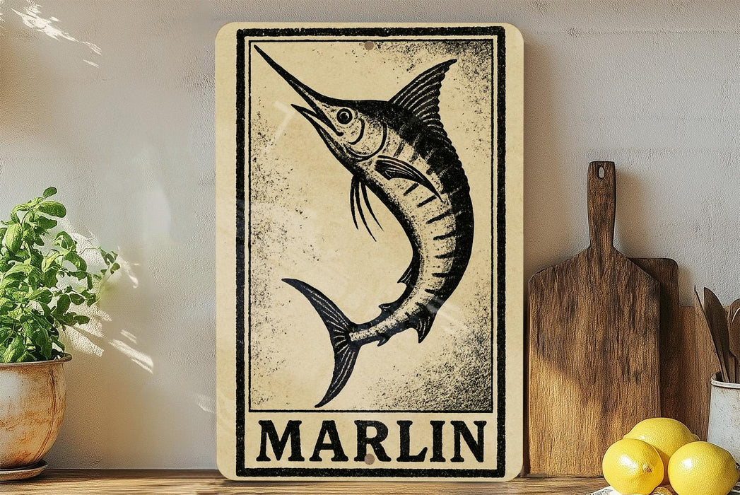 a wooden sign with a black and white illustration of a marlin fish, placed on a wooden surface next to a potted plant and a wooden cutting board.