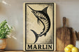 a wooden sign with a black and white illustration of a marlin fish, placed on a wooden surface next to a potted plant and a wooden cutting board.