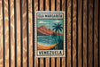 A vintage-style poster of the island of Isla Margarita, located in Venezuela, is displayed on a wooden wall.