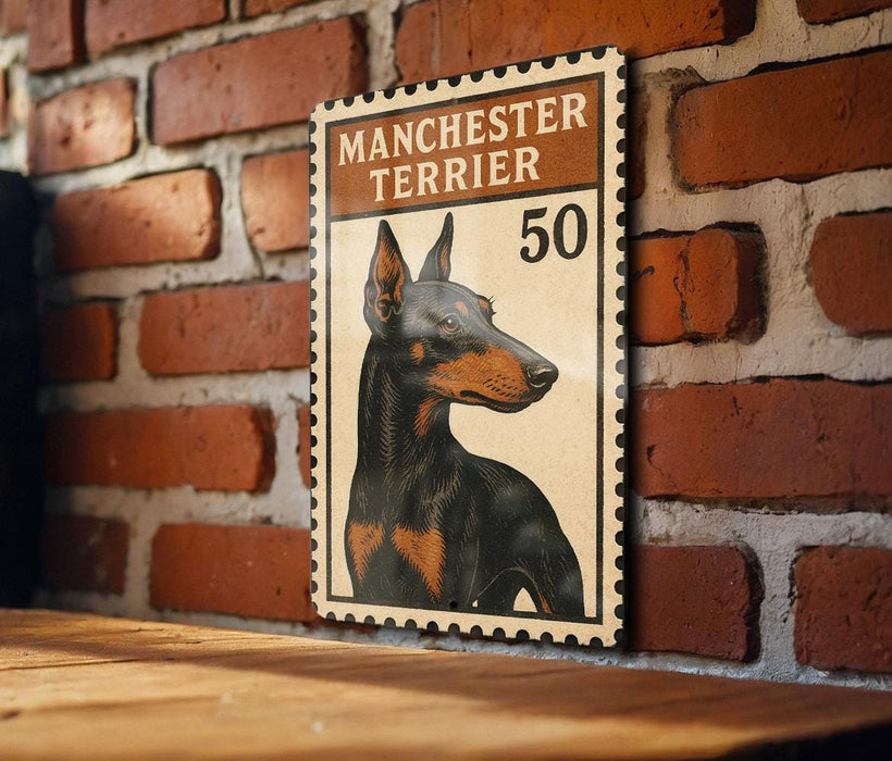 A framed image of a Manchester Terrier dog, with the text "MANCHESTER TERRIER" and the number "50" printed on it, mounted on a brick wall.
