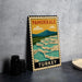 A vintage-style metal sign with the text "PAMUKKALE TURKEY" and an illustration of a scenic landscape with waterfalls.