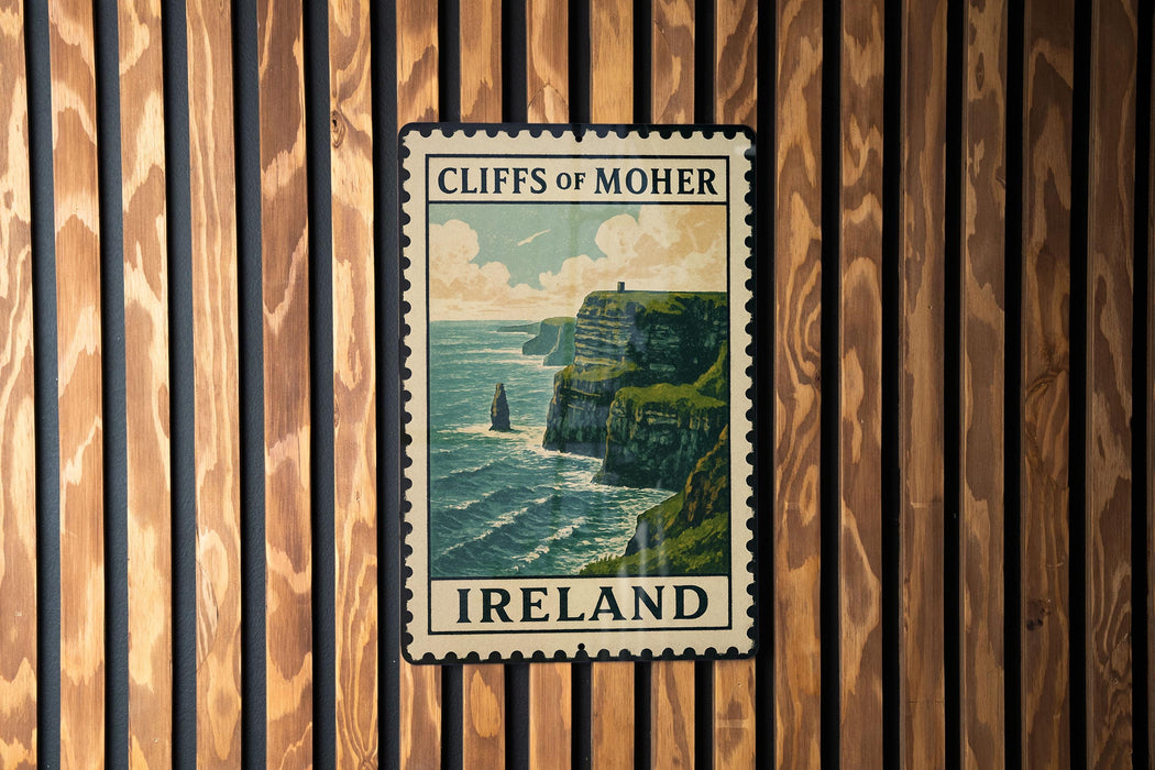 A vintage postage stamp depicting the Cliffs of Moher, a famous natural landmark in Ireland, is displayed on a wooden wall.