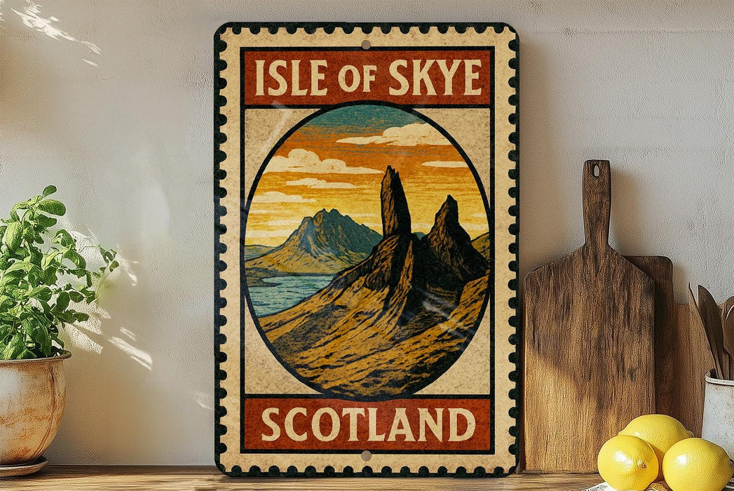 A vintage-style metal sign with the text "ISLE OF SKYE SCOTLAND" and an illustration of a mountainous landscape, placed on a wooden surface next to a potted plant and a wooden cutting board.