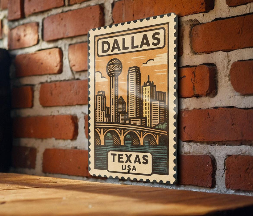 A framed illustration of a cityscape with a bridge and a tower, mounted on a brick wall.