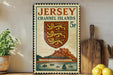 A Jersey Channel Islands postage stamp is displayed on a wall, with a wooden cutting board and a potted plant to the left.
