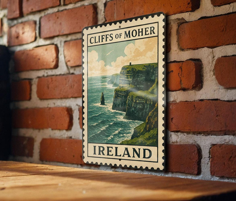 A vintage-style metal sign with the text "CLIFFS OF MOHER" and "IRELAND" printed on it, mounted on a brick wall.