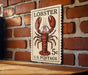 A wooden table with a lobster stamp on it, which is mounted on a brick wall.