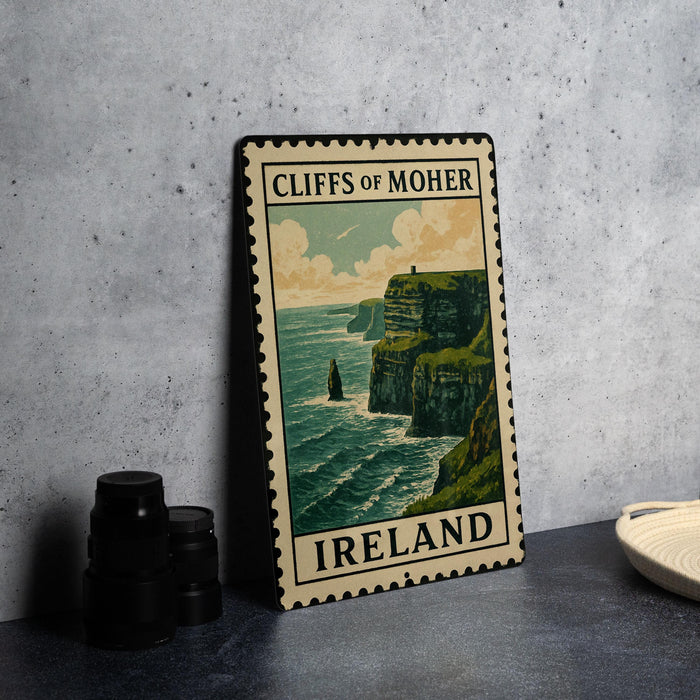 A framed poster of the Cliffs of Moher, a famous natural landmark in Ireland, is displayed on a countertop.