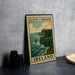 A framed poster of the Cliffs of Moher, a famous natural landmark in Ireland, is displayed on a countertop.