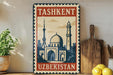 A vintage-style metal sign with the text "Tashkent Uzbekistan" and an illustration of a mosque, placed on a shelf next to a wooden cutting board and a potted plant.