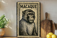 a framed illustration of a monkey on a shelf, with a potted plant to the left and a wooden cutting board to the right.