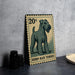 A metal sign featuring a postage stamp with an illustration of a terrier dog, along with the text "Kerry Blue Terrier".
