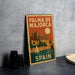A vintage-style metal sign with the text "PALMA DE MAJORCA" and "SPAIN" printed on it, featuring an illustration of a castle and a sailboat.