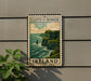A metal sign with a scenic cliffside view of Ireland, mounted on a wall.
