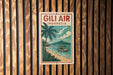 A vintage-style poster advertising Gili Air Indonesia, featuring a palm tree, a boat on the water, and a beach scene.