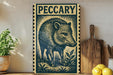 a wooden board with a large illustration of a wild boar, a stamp-like design, and the word "PECCARY" prominently displayed.