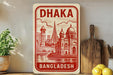 a sign for Bangladesh, with a red and white design depicting a cityscape and a boat.
