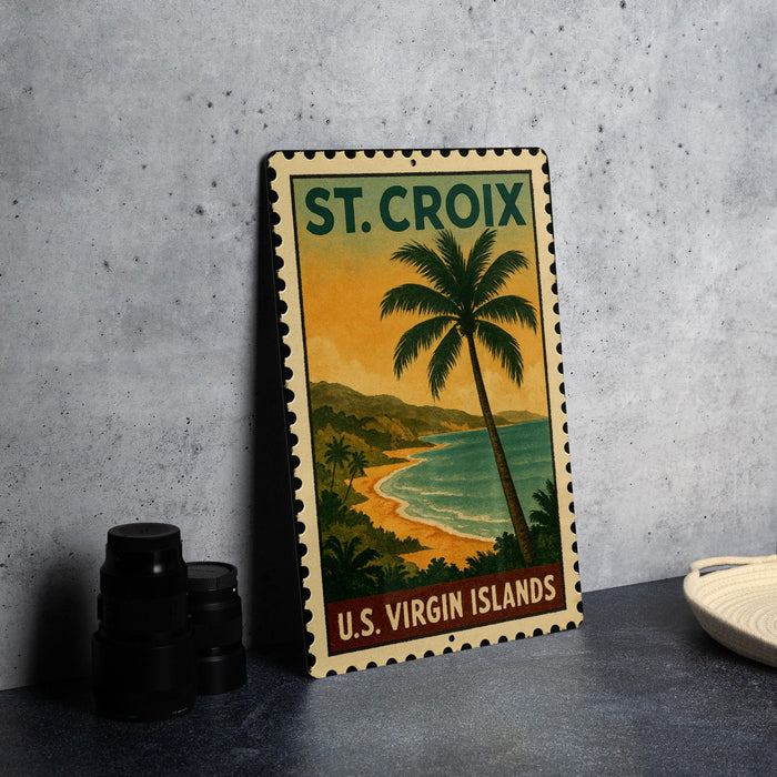 A vintage-style metal sign with a tropical beach scene and palm trees, featuring the text "ST. CROIX U.S. Virgin Islands".
