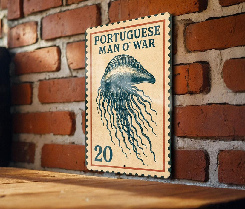 a vintage-style Portuguese postage stamp with an illustration of a jellyfish on it, mounted on a brick wall.