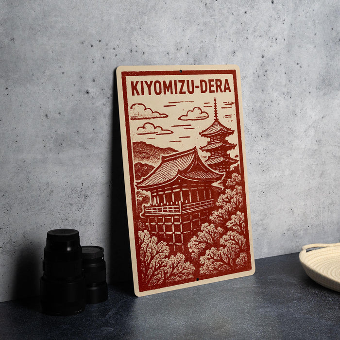 A red and white sign depicting the Kiyomizu-Dera temple in Kyoto, Japan, with a traditional Japanese pagoda in the background.
