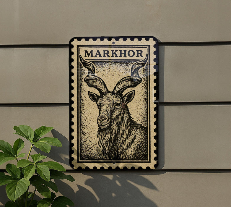 a metal sign with a black and white illustration of a horned animal, possibly a goat or ram, mounted on a wall.