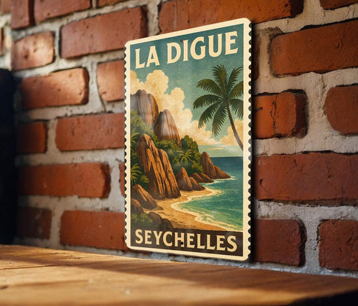 A vintage-style poster of a tropical island landscape, featuring a palm tree, mountains, and a beach, is displayed on a brick wall.
