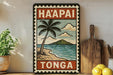 A vintage-style poster of H်ဠI Tဠာ hangs on a wall, depicting a tropical beach scene with palm trees, a mountain, and a blue ocean.