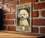 A wooden table with a brick wall in the background, featuring a framed image of a small white dog, which appears to be a Bichon Frise.