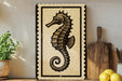 a decorative sign of a seahorse on a shelf, accompanied by a wooden cutting board and a potted plant.