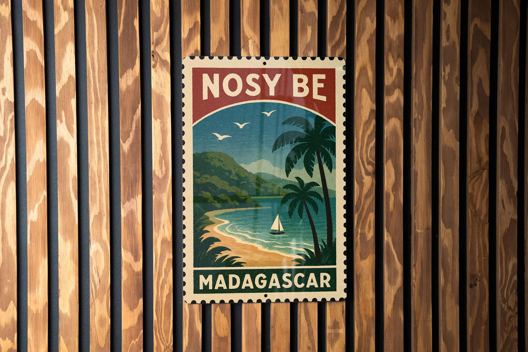 A vintage-style postage stamp from Madagascar, featuring a tropical beach scene with palm trees and a sailboat, is displayed on a wooden wall.