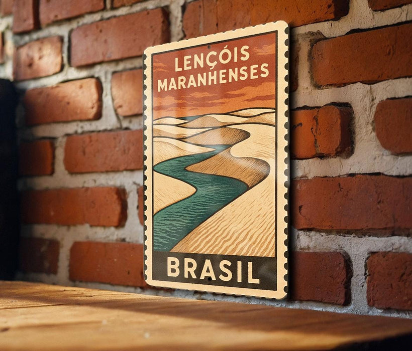 A vintage-style poster of the Lençois Maranhenses, a famous landmark in Brazil, is displayed on a brick wall.