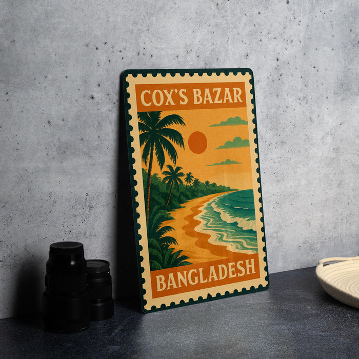 A vintage-style poster or sign for Cox's Bazar, Bangladesh, featuring a tropical beach scene with palm trees and a sunset.