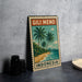A vintage postage stamp featuring a tropical beach scene with palm trees and a body of water, along with the text "GILI MENO INDONESIA".