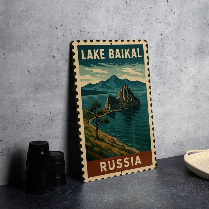 A metal sign with a vintage-style illustration of Lake Baikal, the world's deepest and oldest lake, in Russia.